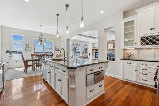 Gourmet Kitchen complete with double oven, 6 burner range, wine fridge, warming drawer, stainless appliances, and built in sideboard bar.