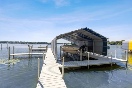Dock and Boathouse are included. Hard sand packed bottom makes this a great swimming area too.