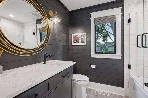 Full bath on main floor with hexagon tile