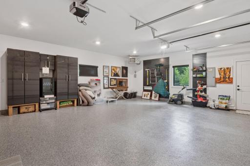 Garage is heated, insulated complete with coated flooring
