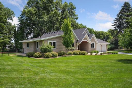 Custom Cedar Shake siding with diamond pattern gable and detailed bracketing