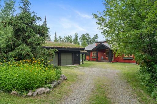 A natural stone and rock drive with native grasses and incredibly maintained grounds.