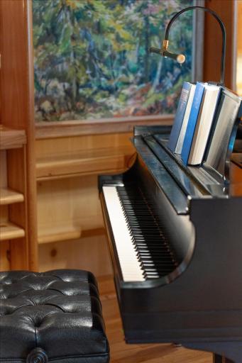 The home was designed for a grand piano or use this space for another sitting area.