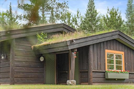 Hand -carved Norwegian Logs from this spectactular master piece of a garage complete with a full heated and finished workshop.