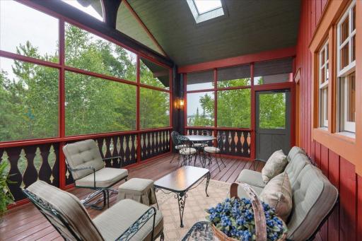 Timeless design, massive screened grid, gorgeous color and fabulous connectivity to the lake.