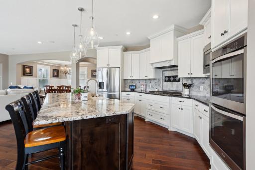 Updated with a designer tile backsplash and premium lighting