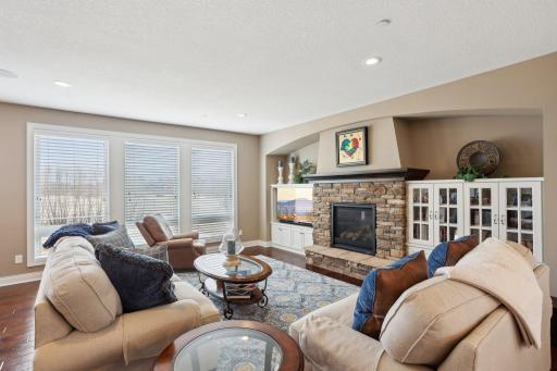 Cozy fireplace anchors the great room for year-round ambiance