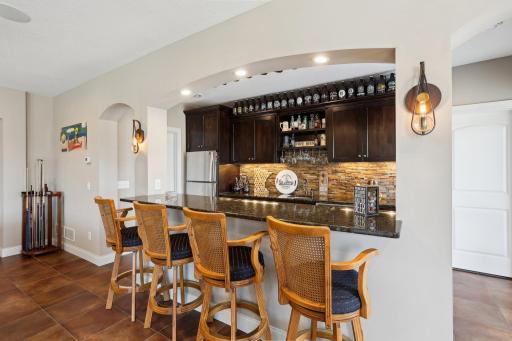 Full wet bar with bar seatingâperfect for hosting happy hours or holidays