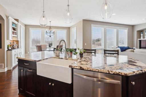 Kitchen views overlook the peaceful backyard and Bluff Creek