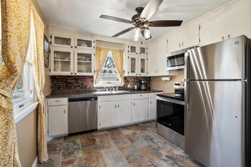 The Kitchen with new appliances including the refrigerator, range and dishwasher