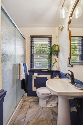 The main floor bathroom with a pedestal sink