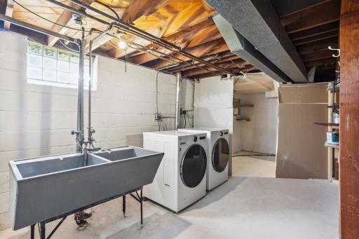 The lower level laundry with a new high end LG Laundry pair