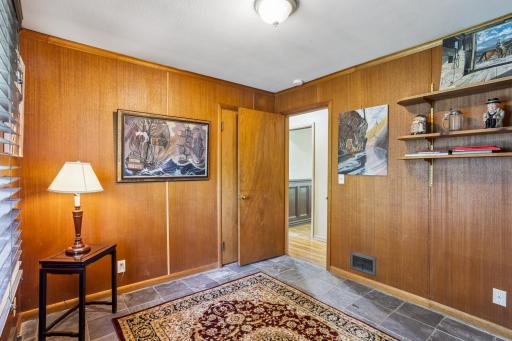 The main floor paneled 3rd bedroom