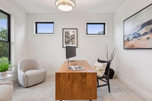 Enjoy working in your office that can be closed off by your glass french doors