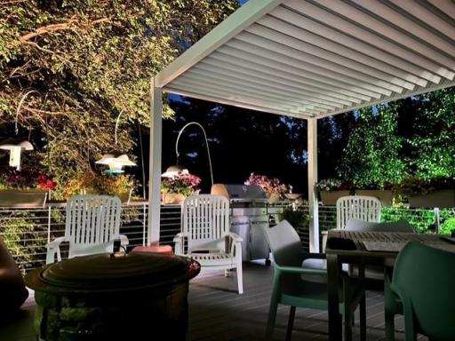 Peaceful and serene patio with pergola that has adjustable louvres