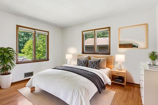 One of 4 bedrooms on the main level with attached half bath