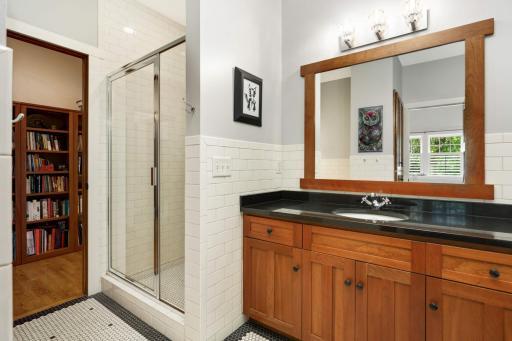 Another four piece bathroom with separate tub and shower on this level.