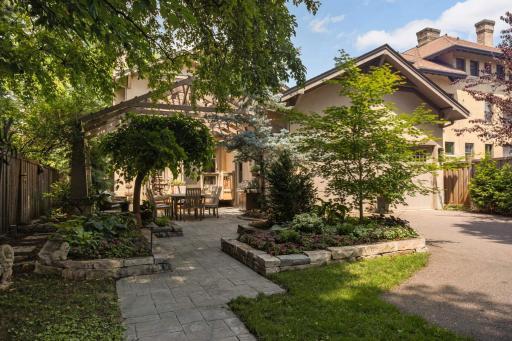 The exquisite landscaping is carried throughout the lot into the backyard.