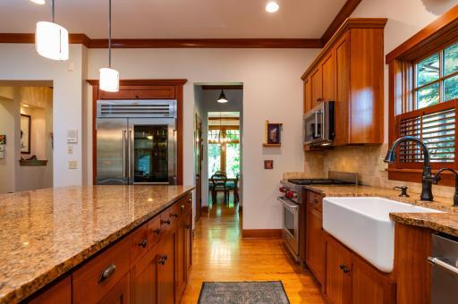 Walk through the wet bar space with walk-in pantry as you exit the kitchen and enter the formal dining room.