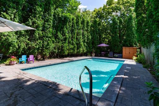 The private pool area with new tile and electric pool cover.