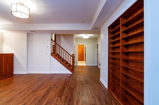 The inviting lower level is loaded with charm with all of the built-ins and niches.