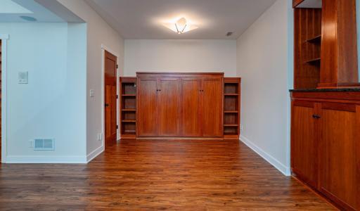 Looking for more space for guest? This beautiful cabinet is a pull out Murphy bed!
