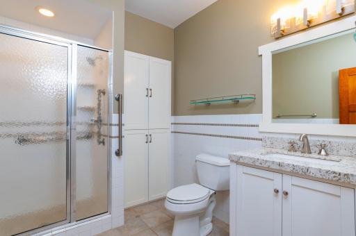 A three quarter bathroom serves the lower level of the home.