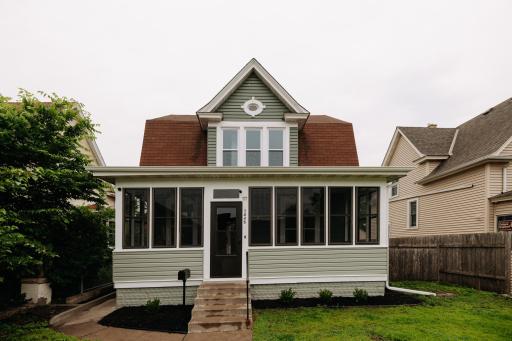 Charming front view with an enclosed porch