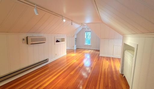 The upper level is a spacious primary bedroom with beautiful hemlock/fir floors and room for a bath, office or more closets.