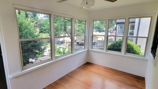 The back porch overlooks the patio and gardens. it is east facing so that it gets gorgeous morning sun.
