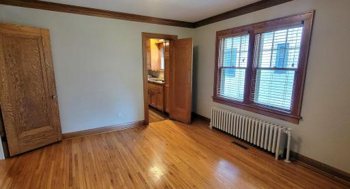 Spacious dining room with swinging door to the kitchen.