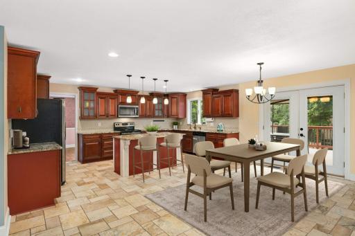 Virtually staged kitchen and informal dining room.