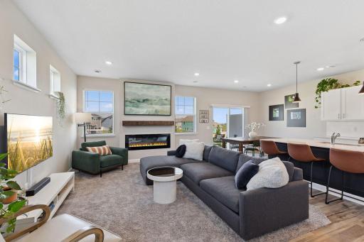 Open floor plan with nice size family room with electric fireplace