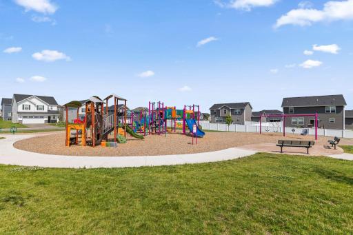Prime location with easy access to the park, basketball court, putting green, and guest parking.