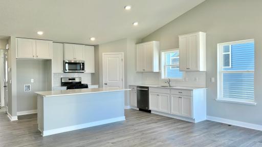 Welcome home to 2474 La Tour Drive in Shakopee! Bright and spacious kitchen, open floorplan with vaulted ceilings, finished basement + more! Move-in ready, new construction providing piece of mind for years to come!
