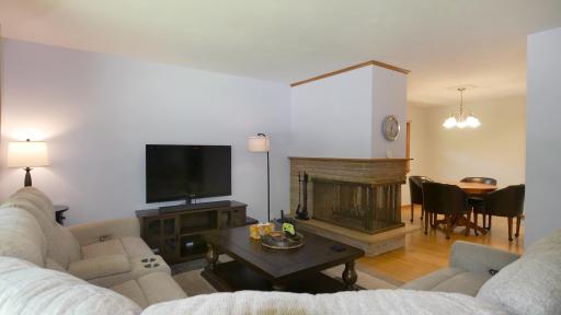 Living room with 3-sided fireplace...