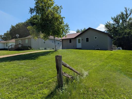 A deep front yard and with space for outdoor furniture or play area.
