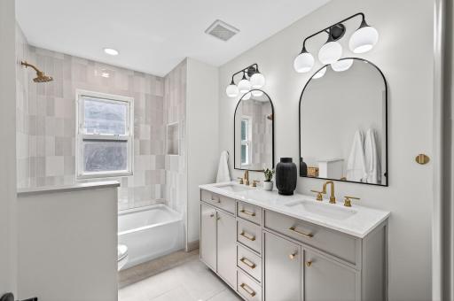 This 4 bedroom, 3 bathroom home features a stunning main floor suite with a luxurious tiled full bath and dual vanity.