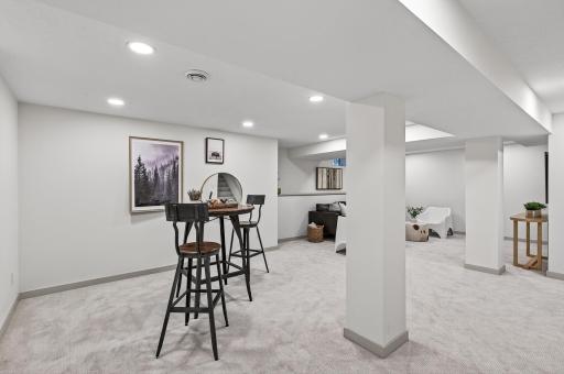 The finished lower level includes a large family room, flex space, fourth bedroom, and a designer ¾ bath, creating endless possibilities for work, guests, or play.