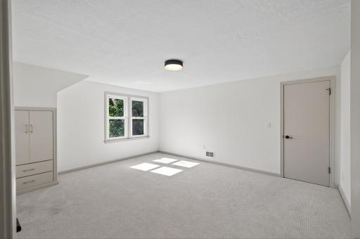 Enormous upper level 2nd bedroom with dual closets & built-ins.