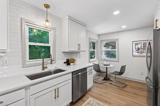All new vinyl plank flooring, new semi-custom kitchen cabinets, new quartz countertops, new stainless steel appliance package.