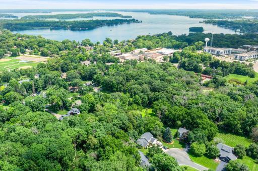 This 1.8-acre property offers exceptional flexibility and investment potential. Nestled on a level, fully fenced lot just minutes from the Lake Minnetonka LRT Trail and vibrant downtown Excelsior.