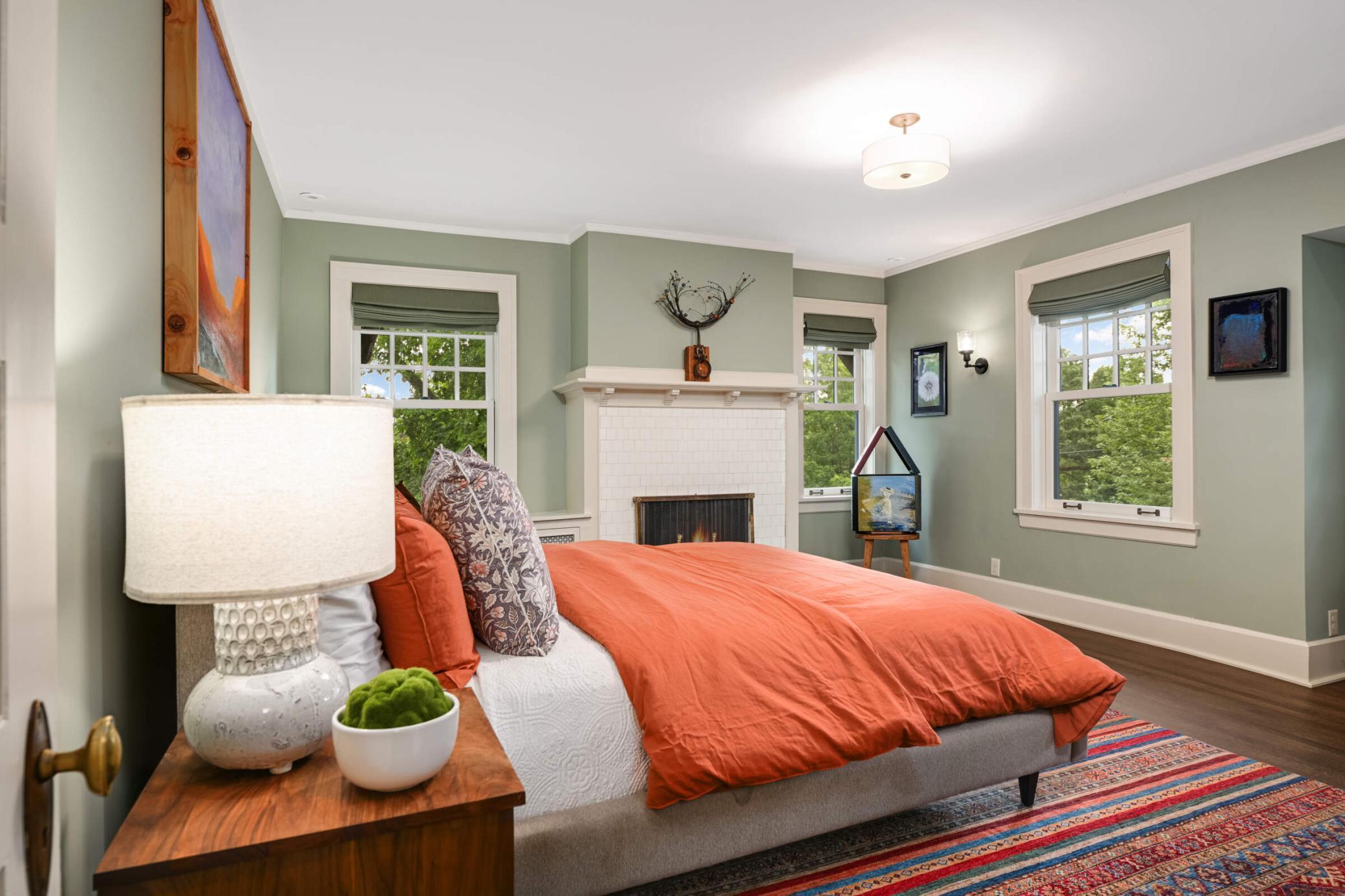 Primary bedroom with decorative fireplace and views of LOTI.