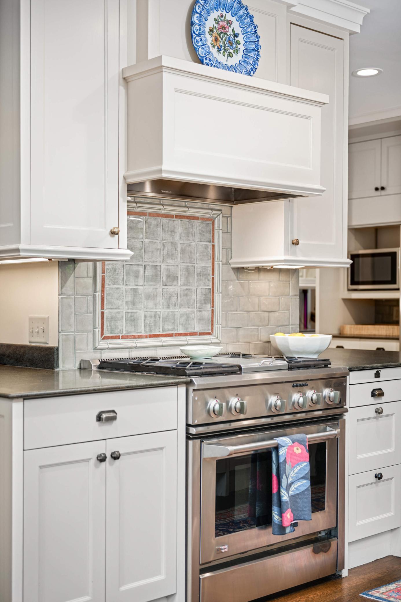 Inset cabinetry, custom tile, professional appliances...