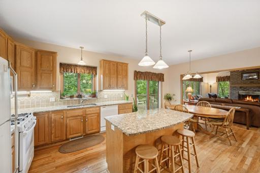 Custom oak raised panel cabinets highlight the craftsmanship and quality. Uppers are extended to 42 inches. The center island serves as a convenient breakfast spot or work area for the homeâs chef. Plants will thrive in the kitchen window ledge.
