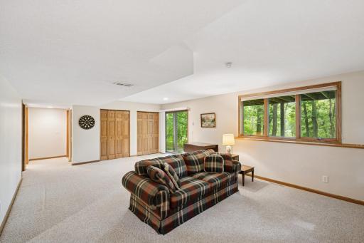 There is a lot of room to make this space your own. Lower level family room view.