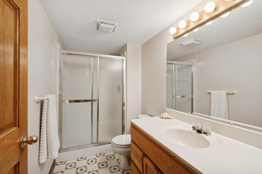 The lower level 3/4 bathroom enhances the guest quarters, giving overnight visitors their own private space.