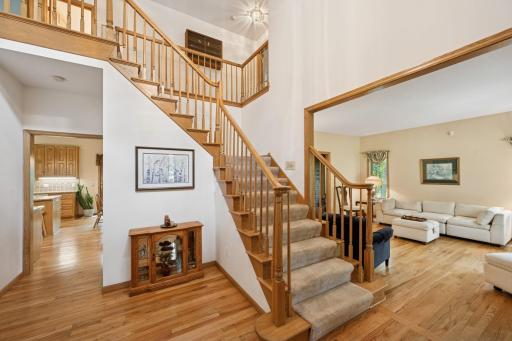 A grand two-story foyer showcases elegant wood balusters, creating a stately and welcoming entrance. The neutral dÃ©cor provides the perfect canvas to personalize the decor and make this space your own.