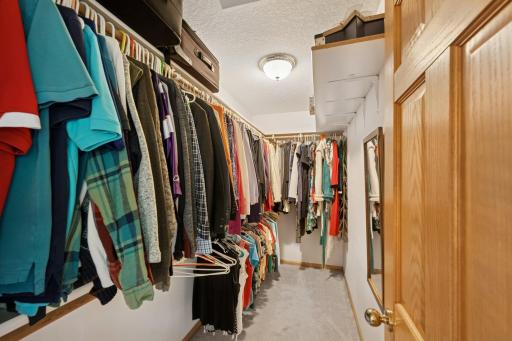 Owner's closet with loads of room. No need to switch out season clothing, there is room for it all.