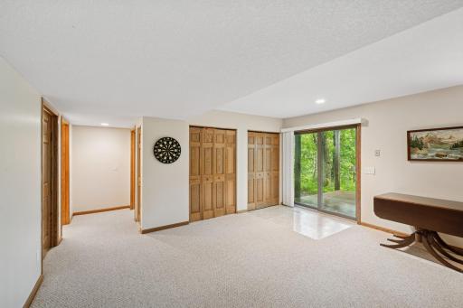The family room provides ample space for multiple gaming areas and opens to a lower wooden deckâperfect for birdwatching or catching a glimpse of deer wandering by. The local wildlife here is truly exceptional!